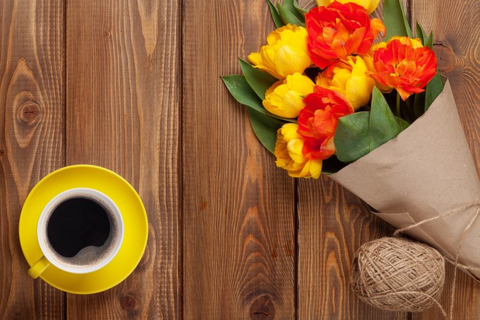 Bouquet of Tulips and Coffee on Wooden Table