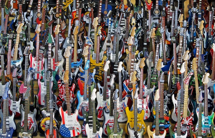 A large collection of electric guitars