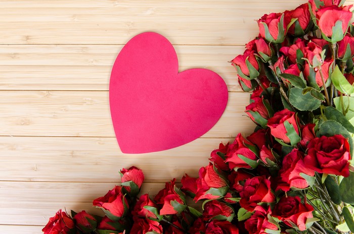 Red Roses and Pink Heart on Wood Planks
