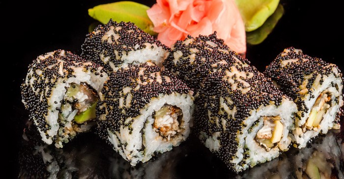 Sushi rolls with black caviar and ginger