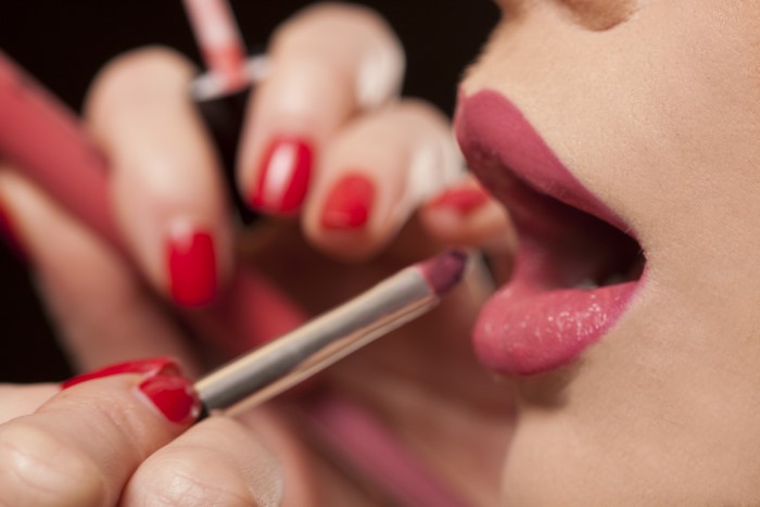 Applying Lipstick to Lips