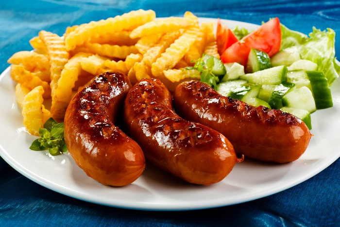 Sausages with French fries and salad