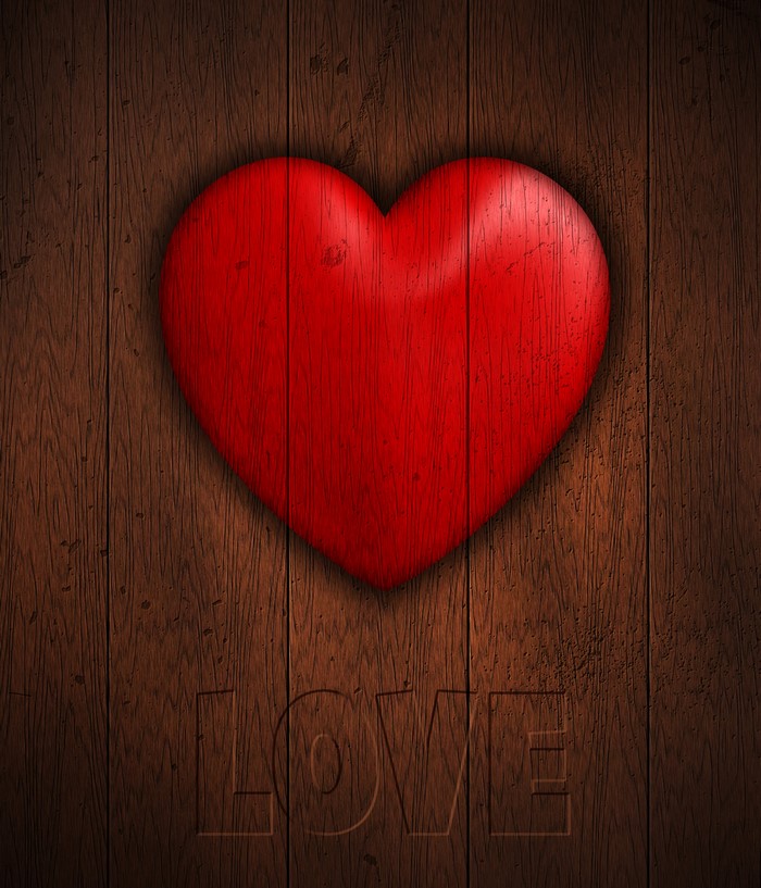 Red Heart on Wood Planks with "LOVE" Carved