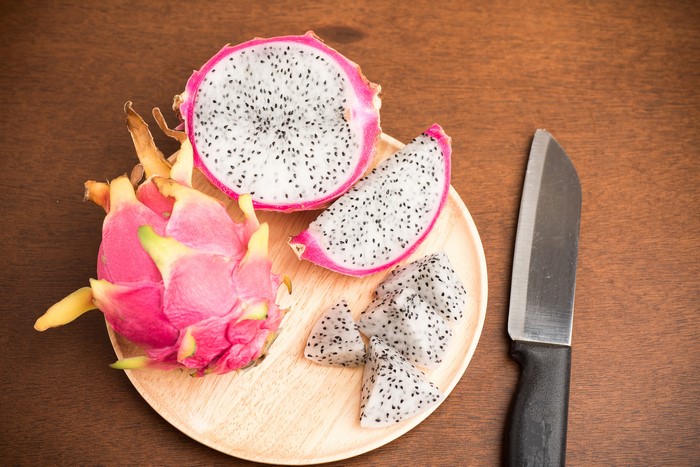 Dragon Fruit on a Plate with a Knife
