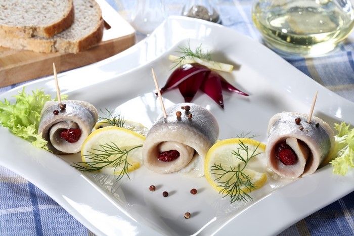 Herring rolls with lemon, dill, and bread