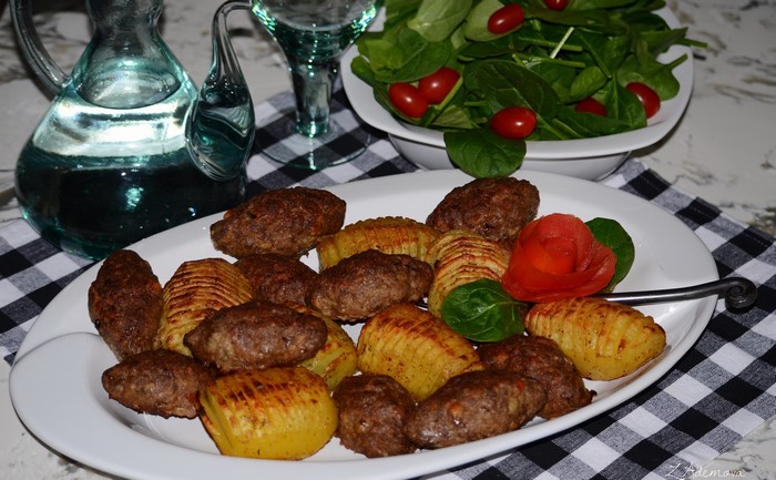 Meatballs and Hasselback Potatoes on a Plate