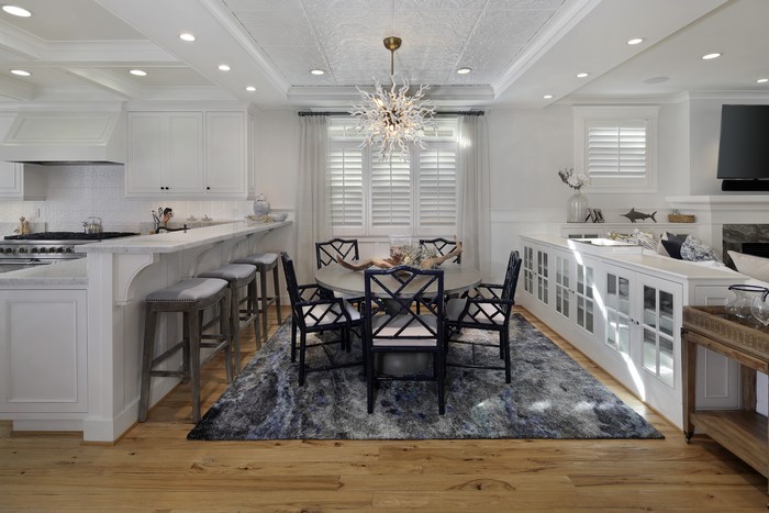 Kitchen and Dining Area with Chandelier and Chairs