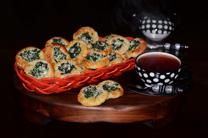 Pastries with spinach and tea