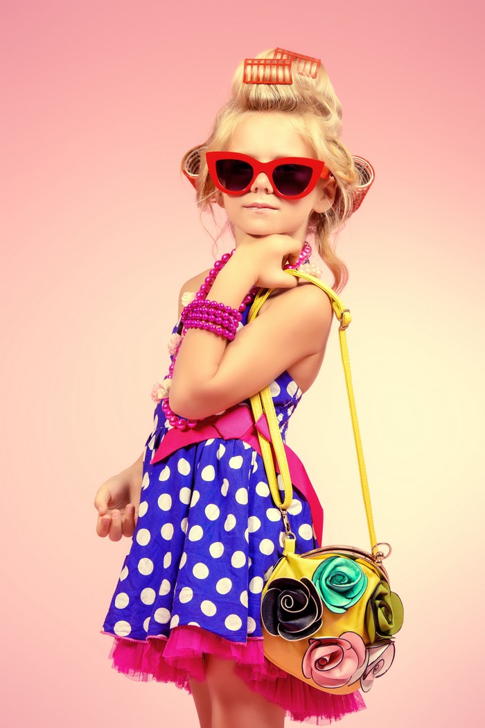 Girl with sunglasses and handbag