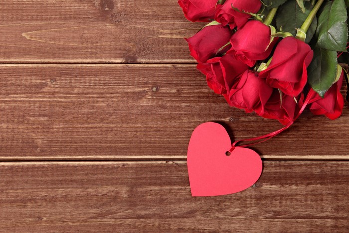 Red Roses and Heart Tag on Wood