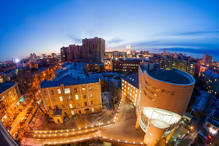Cityscape at Dusk with Modern and Old Buildings