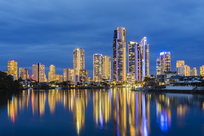 Skyscrapers reflecting in a river at dusk in Australia
