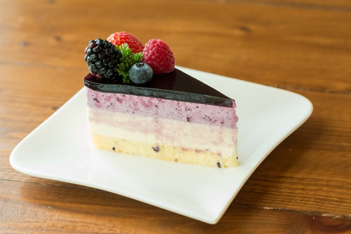 Slice of Berry Mousse Cake with Fresh Berries