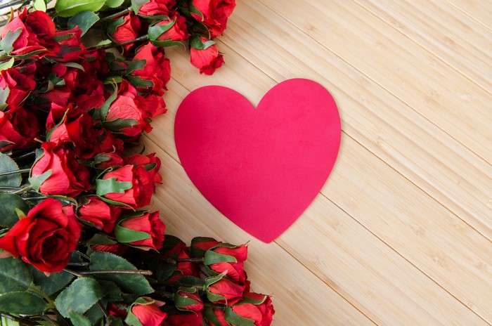 Red Roses and a Pink Heart on Wood