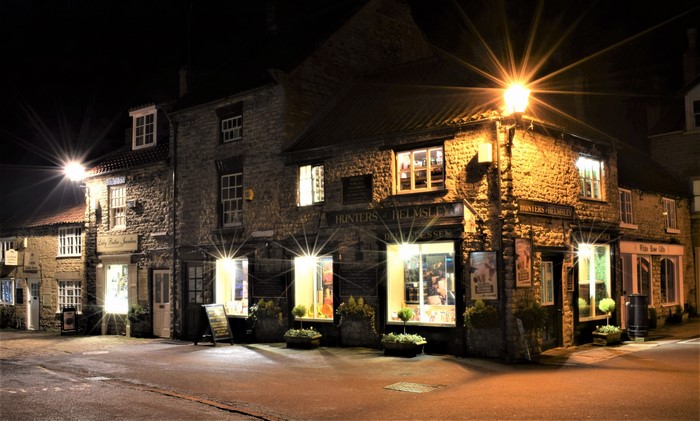 Night view of shops in Helmsley, North Yorkshire, England