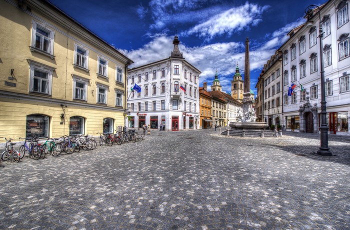 Ljubljana, Slovenia: Cobblestone Square with Fountain and Buildings