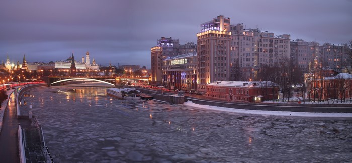 Moscow cityscape with Kremlin and Moskva River at dusk