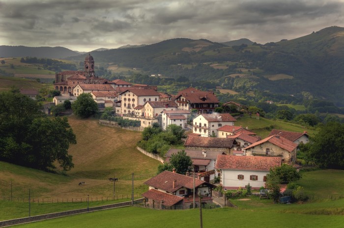 Village of Ziga in Navarra, Spain, surrounded by mountains and fields