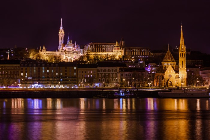 Budapest Hungary cityscape at night with river reflections