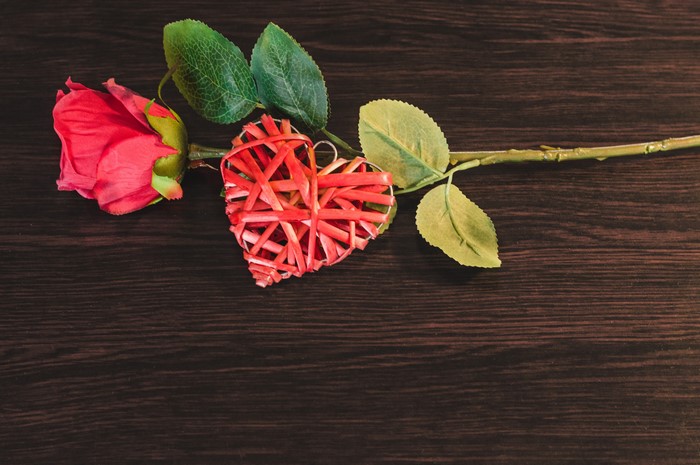 Red Rose and Woven Heart on Dark Wood