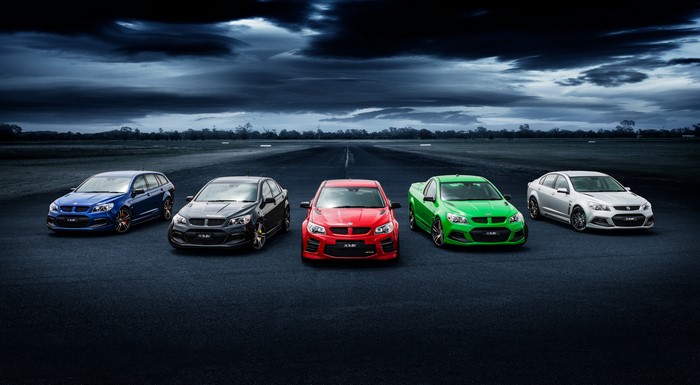 Five Holden cars lined up on a runway