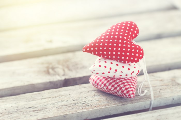 Three hearts on wood planks