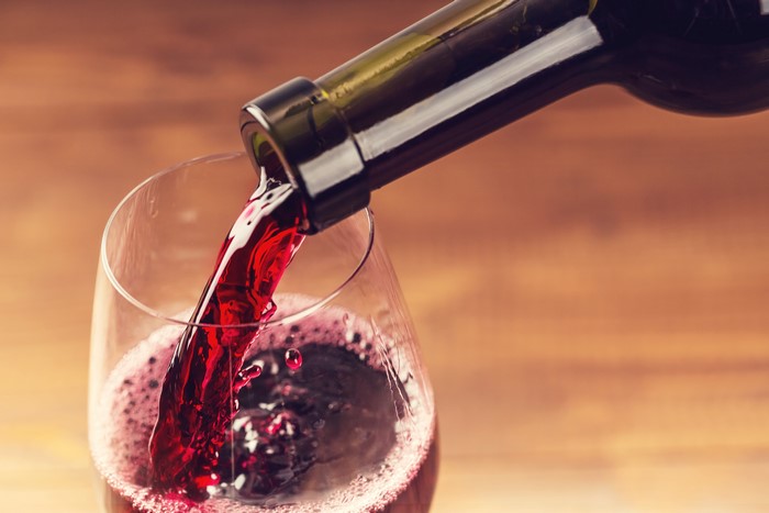Red Wine Being Poured into a Glass