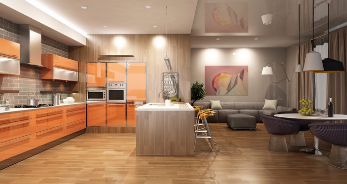 Modern open-plan kitchen and living area with orange cabinets