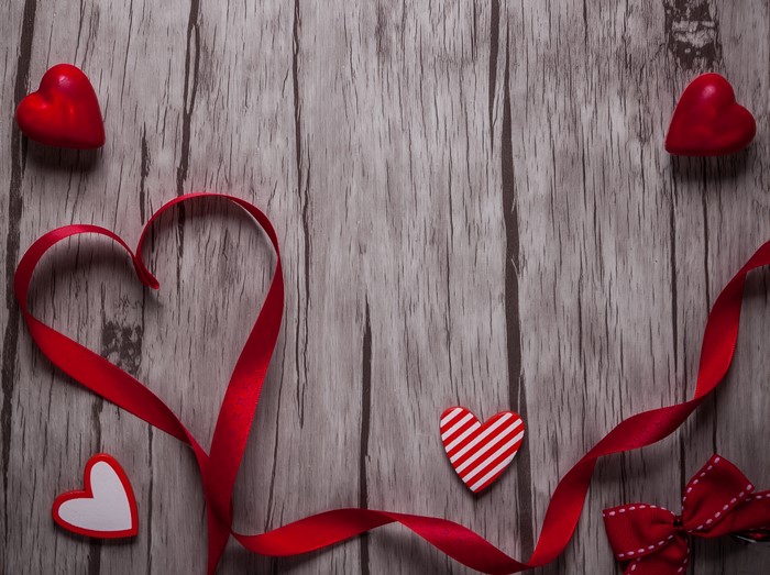 Valentine's Day Red Ribbon and Hearts on Wood