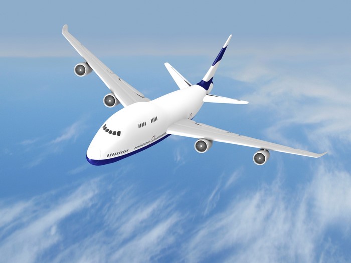 White airplane flying in the sky