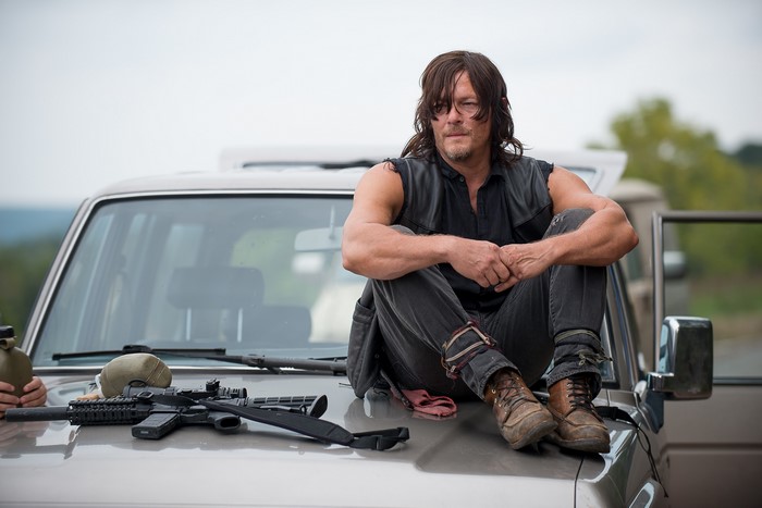 Daryl Dixon from The Walking Dead sitting on a car