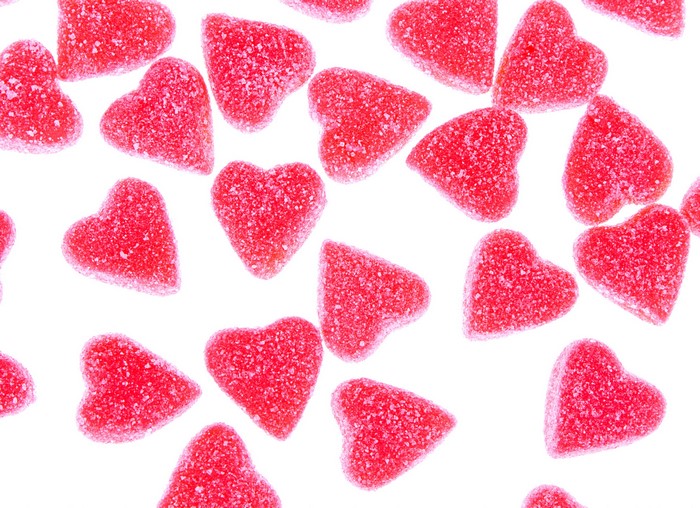 Red heart-shaped marmalade candies with sugar coating