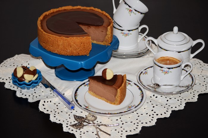 Chocolate cake with coffee and candies