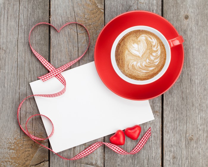 Valentine's Day coffee with heart ribbon and note
