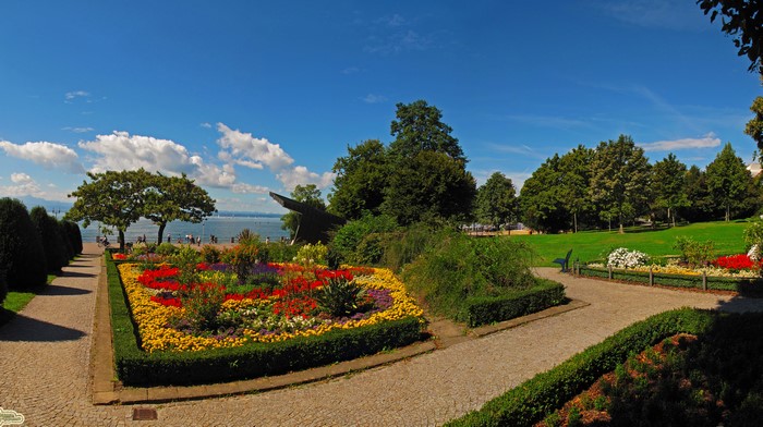 Park with flower beds and lake in Friedrichshafen, Germany