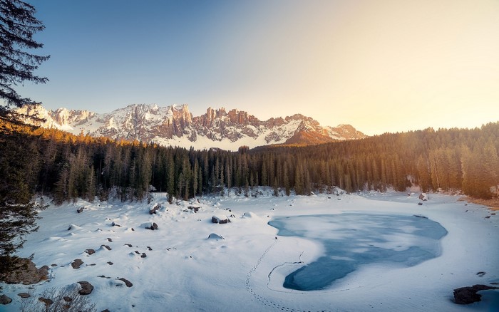Snowy Mountains and Forest with Frozen Lake in Italy