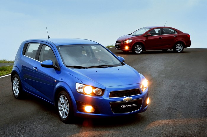 Two Chevrolet Sonic cars on a road