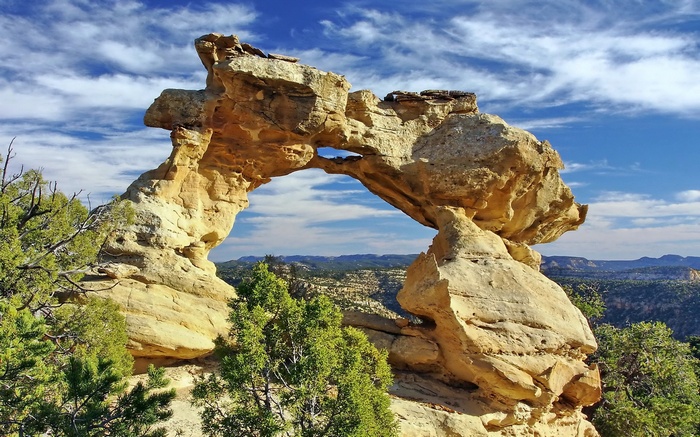 Natural sandstone arch with a hole in the middle