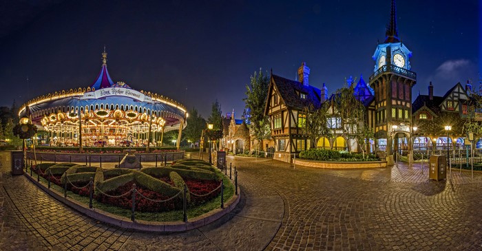 Disneyland Carousel and Tudor-style Buildings at Night