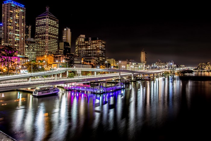Brisbane cityscape at night with river and bridges