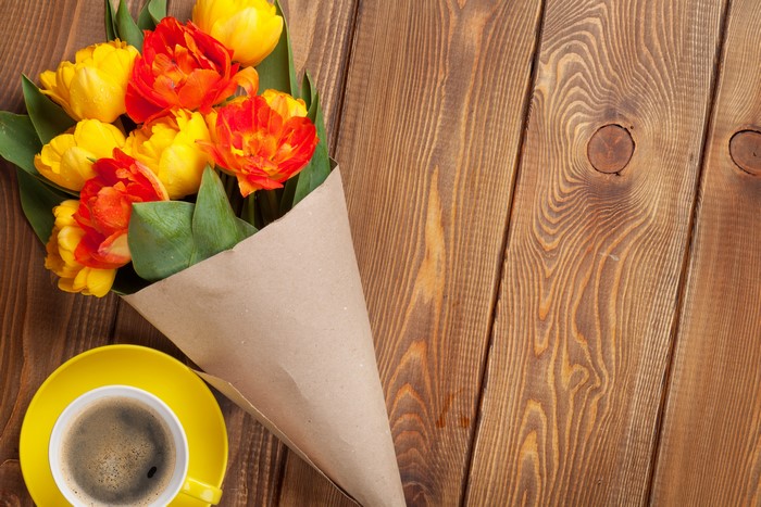Bouquet of Tulips and Coffee on Wood