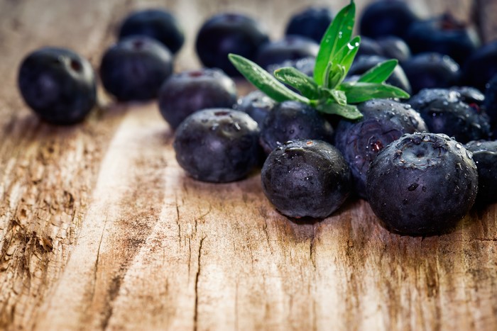 Blueberries on a wooden surface