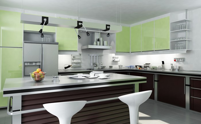 Modern kitchen with green cabinets and island