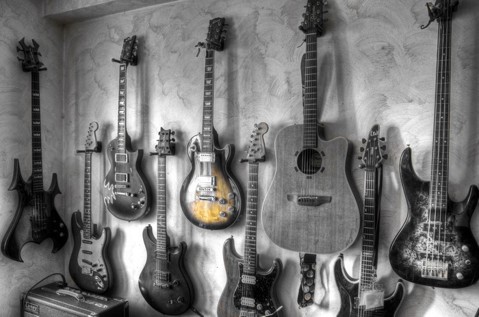 Collection of Guitars on a Wall