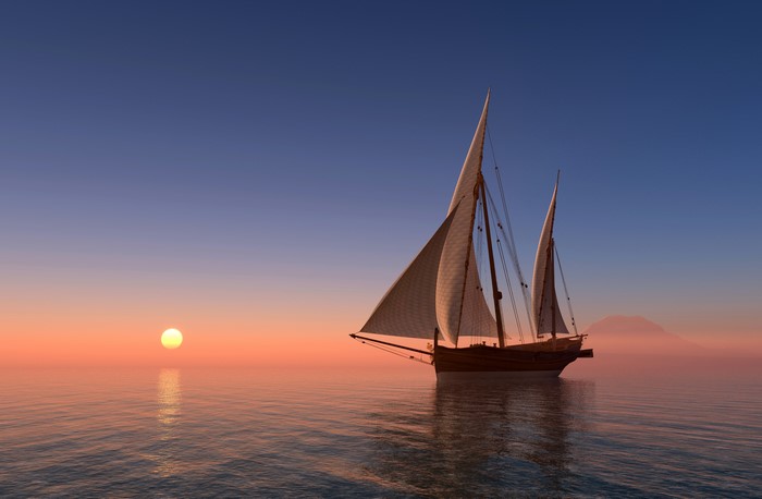 Sailboat on the sea at sunset