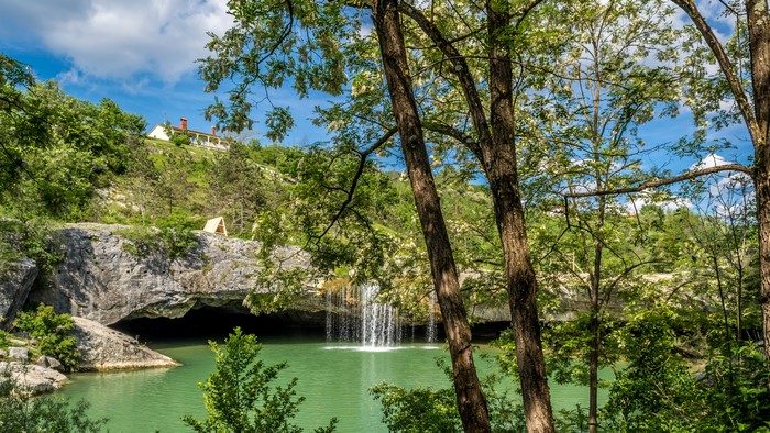 Waterfall cascading into a turquoise pool in Croatia