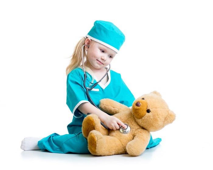 Girl in Nurse Costume with Teddy Bear