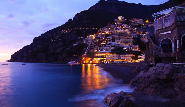 Positano, Italy coast at dusk with illuminated houses