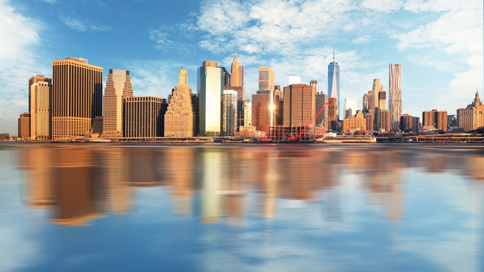 New York City skyline with reflections in water