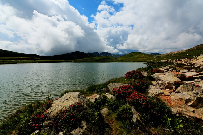 Lake Lombarde in Italy with Stones and Clouds